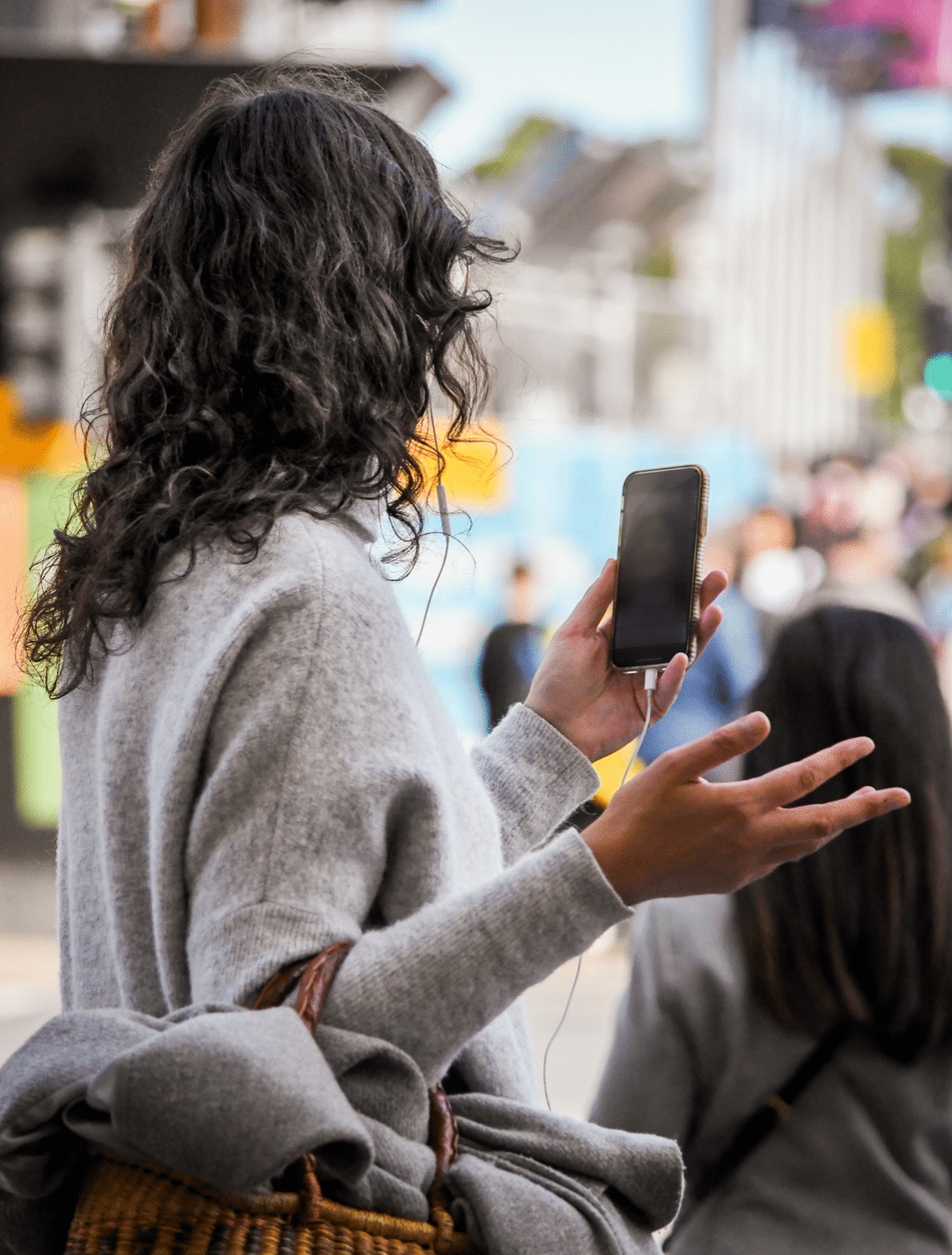 Woman using video call function while walking on the street